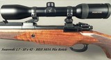 RIGBY 375 H&H- DOUBLE SQUARE MAUSER M98 MAG ACTION- SUPERB FLOORPLATE ENGRAVING- EXC WOOD- SWAROVSKI w/ QD PIVOT MOUNTS- BUILT in 2015- OVERALL 97% - 2 of 10