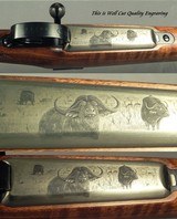 RIGBY 375 H&H- DOUBLE SQUARE MAUSER M98 MAG ACTION- SUPERB FLOORPLATE ENGRAVING- EXC WOOD- SWAROVSKI w/ QD PIVOT MOUNTS- BUILT in 2015- OVERALL 97% - 5 of 10