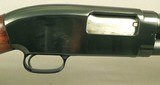 WINCHESTER MODEL 12 FEATHERWEIGHT with a AAA DELUXE WINCHESTER CHECKERED BUTTSTOCK -OVERALL ORIG BLUE at 99% -THE WOOD at 97% -TOTALLY APPEARS UNFIRED - 4 of 5