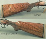 CHAPUIS LEFT HAND 375 H&H - MODEL IPHISI CLASSIC - VERY NICE WOOD - CASE COLORED FRAME - PIVOT MOUNTS - TRIJICON 1-6x24 SCOPE - 25 5/8