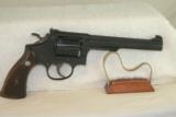 S&W K38, 5 Screw with original Gold box. Made in 1953.
- 1 of 6