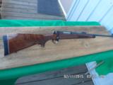 REMINGTONMODEL 700 BDL DELUXE IN (RARE) 8MM REM.MAG ,BEAUTIFUL FIGURED WALNUT,AS NEW,UNFIRED CONDITION! - 1 of 10
