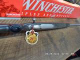WINCHESTER MODEL 70 (MFG 1998-1999 ONLY) CLASSIC LAMINATED STAINLESS BOSS 300 WIN.MAG.DELUXE RIFLE NIB W/PAPERWORK, - 14 of 17