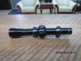 LEUPOLD M8 PISTOL SCOPE 2X WITH RINGS.- 1 of 4
