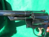 SMITH & WESSON MODEL 29
8 3/8 BARREL WITH PRESENTATION BOX AND BOX
- 9 of 10