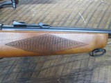 mossberg 42b .22lrHas peep sight and mossberg scope. - 5 of 11