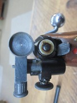 mossberg 42b .22lrHas peep sight and mossberg scope. - 9 of 11