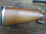 mossberg 42b .22lrHas peep sight and mossberg scope. - 2 of 11