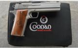 Coonan Arms .357 Magnum Automatic in the case. - 1 of 2
