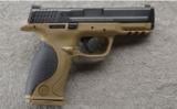 Smith & Wesson M&P 40 in .40 S&W, Desert Tan in Case. - 1 of 3