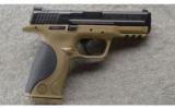 Smith & Wesson M&P 40 in .40 S&W, Desert Tan in Case. - 1 of 3