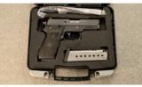 Sig Sauer P220
.45 ACP with .22 LR Conversion Kit and Crimson Trace laser - 4 of 5