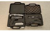 Sig Sauer P220
.45 ACP with .22 LR Conversion Kit and Crimson Trace laser - 3 of 5