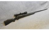 Weatherby Mark V Synthetic in .257 WBY Mag w/ Zeiss scope - 1 of 9