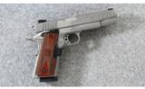 Taurus PT1911 Stainless w/Laser Grips .45acp - 1 of 3