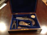 Antique cased London percussion pistol with accessories swivel barrel- 2 of 10