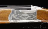 RUGER Red Label
beautifully Hand Engraved by Robert Strosin - 3 of 5