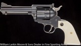 RUGER
New Model Blackhawk Convertable tuned by Bob James .45LC/.45ACP 4 1/2" Blue, Tuned by Bob James - 2 of 6