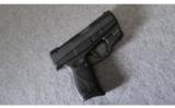 Taurus PT709 SLIM 9MM w/ LaserLyte and Holster - 1 of 2