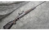 Remington Model 700 - Stainless, laminated Stock~ 7MM Rem Mag - 1 of 9