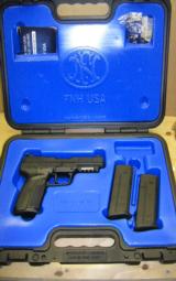 F.N.H. 5.7 X 28, 4 - 20 Round Magazines, 4 - 30 Round Magazines and Holster - 1 of 3