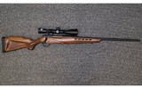 Mossberg~4X4~7 mm Remington Magnum - 1 of 7
