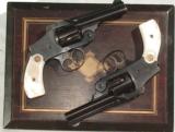 PAIR OF SMITH & WESSONNEW DEPARTURE REVOLVERS WITH FACTORY PEARL GRIPS.38 S&W