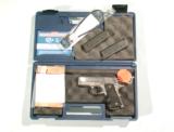 COLT DEFENDER MODEL 1911 STAINLESS STEEL AUTO IN .45 a.c.p. - 1 of 6