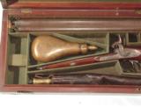 12 BORE PERCUSSION DOUBLE SHOTGUN.
BY KAVANAGH IN ITS
ORIGINAlL BOX - 2 of 14