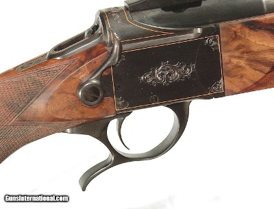 LUXUS ARMS MODEL 11
SINGLE SHOT SPORTING RIFLE
ENGRAVED WITH GOLD BANDING IN .243 WIN. CALIBER