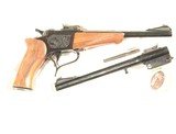 THOMPSON CENTER SINGLE SHOT PISTOL WITH 2 SETS OF BARRELS
.44 MAGNUM & .22 LONG RIFLE - 1 of 7