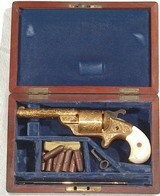 CASED EXHIBITION ENGRAVED AND GOLD PLATED MOORES FRONT LOADING TEAT FIRE REVOLVER - 1 of 8