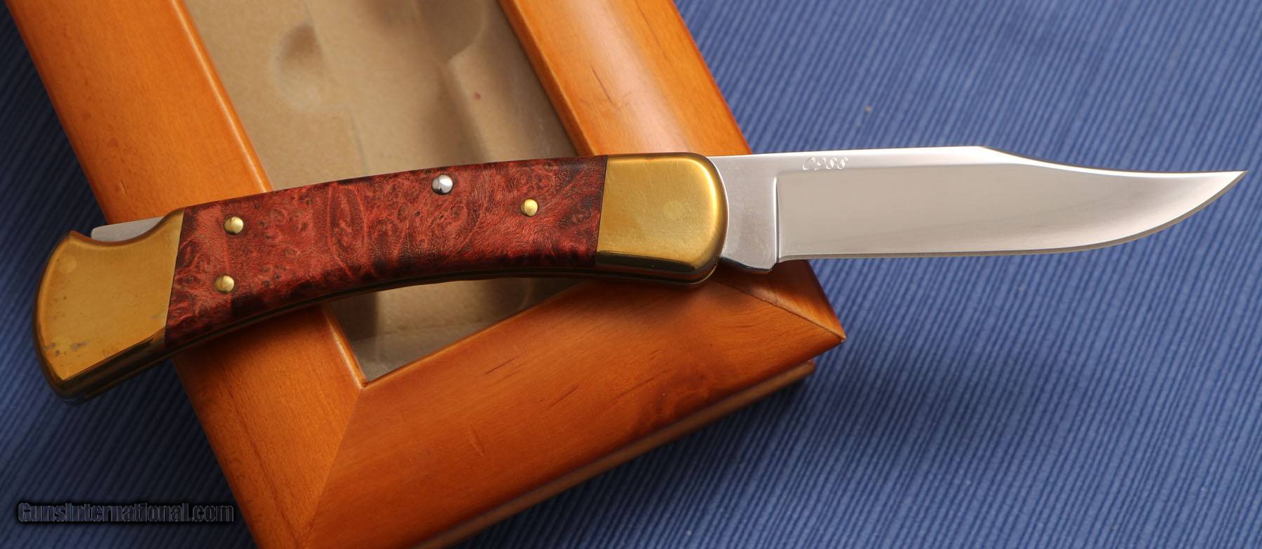 Sold at Auction: Buck 110 & Cooking Guild Knives, Scope, Cleaning