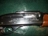 Remington 1100 12ga. modified choke barrel. - 1 of 5
