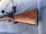 Remington 40X 27" SS HB 243 win. Walnut target stock w/rail, All American 20X A/O scope in place