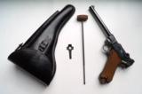 1916 DWM MILITARY NAVY GERMAN LUGER RIG WITH MATCHING # MAGAZINE-MINT
- 1 of 12