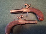 CASED PAIR OF SCREW BARREL, FOLDING TRIGGER, PERCUSSION MUFF PISTOLS - 11 of 15