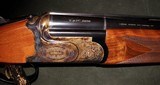 CAESAR GUERINI LEFT HAND SUMMIT SPORTING LTD 12GA O/U SHOTGUN - 1 of 5