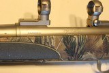 Remington M700 Stainless Camo 30-06 caliber with scope mounts - 1 of 6