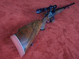 Engraved Ludwig Borovnik of Austria Single Shot Stalking Rifle in 7 mm Magnum with 1 1/2-5 Scope in Claw Mounts. AAA Fancy Walnut Stock. - 1 of 20