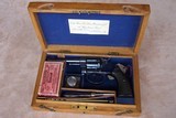 Colt New Police chambered in .32 Police Cartridge housed in a British Case with lots of Accessories. Excellent complete package.