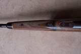 Gary Stiles Switch Barrel Mauser action rifle in .25-06 and .35 Whelen with 1 1/2-4 1/2 and 3-9 Swarovski scopes in Huey Trunk Case W/Accessories - 8 of 18