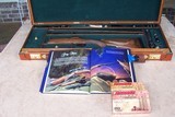 Gary Stiles Switch Barrel Mauser action rifle in .25-06 and .35 Whelen with 1 1/2-4 1/2 and 3-9 Swarovski scopes in Huey Trunk Case W/Accessories - 5 of 18