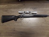 REMINGTON M-700 STAINLESS RIFLE
IN .300 WINCHESTER MAG W/LEUPOLD SCOPE - 1 of 10