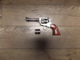 RUGER NEW MODEL SINGLE SIX
STAINLESS
REVOLVER 22 LR, 22 MAG - 2 of 2