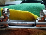 SAVAGE116 in 270 win. STAINLESS STEEL FLUTED BARREL WITH A FACTORY ADJUSTABLE MUZZLE BRAKE, GREEN LAMINATED STOCK, VERY HARD TO FIND MODEL! - 12 of 17