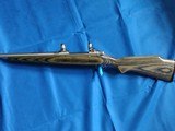 SAVAGE116 in 270 win. STAINLESS STEEL FLUTED BARREL WITH A FACTORY ADJUSTABLE MUZZLE BRAKE, GREEN LAMINATED STOCK, VERY HARD TO FIND MODEL! - 2 of 17