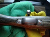 SAVAGE116 in 270 win. STAINLESS STEEL FLUTED BARREL WITH A FACTORY ADJUSTABLE MUZZLE BRAKE, GREEN LAMINATED STOCK, VERY HARD TO FIND MODEL! - 8 of 17