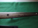 SAVAGE116 in 270 win. STAINLESS STEEL FLUTED BARREL WITH A FACTORY ADJUSTABLE MUZZLE BRAKE, GREEN LAMINATED STOCK, VERY HARD TO FIND MODEL! - 15 of 17