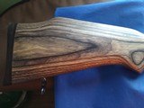 SAVAGE116 in 270 win. STAINLESS STEEL FLUTED BARREL WITH A FACTORY ADJUSTABLE MUZZLE BRAKE, GREEN LAMINATED STOCK, VERY HARD TO FIND MODEL! - 10 of 17